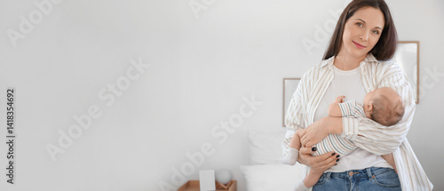 Happy mother holding her cu...