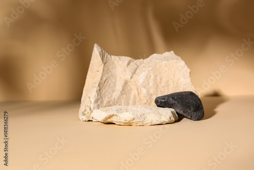 Decorative stone podiums on pale orange background
