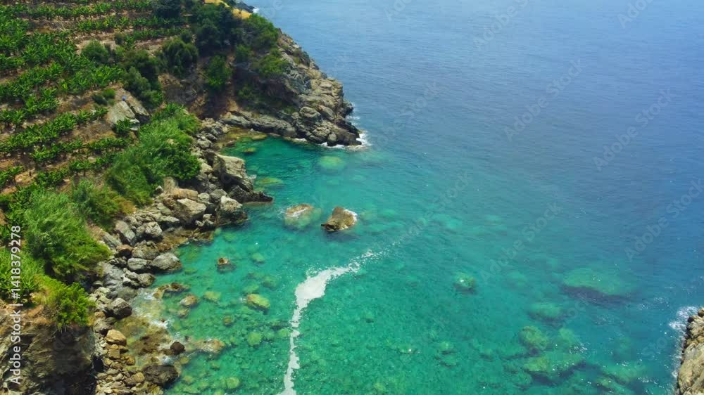A bird's-eye view of the Blue lagoon in Gazipasa. A beautiful sea bay with mountains overgrown with shrubs and banana plantations, descending to the sea in Turkey, Alanya.The drone.Filming in the air A bird's-eye view of the Blue lagoon in Gazipasa. A beautiful sea bay with mountains overgrown with shrubs and banana plantations, descending to the sea in Turkey, Alanya.The drone.Filming in the air