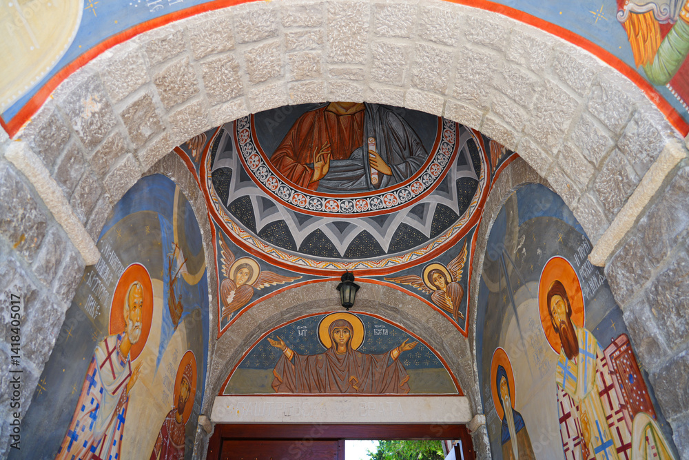 Interior of the Reževići Monastery in Montenegro - Church of the Dormition of the Mother of God of the Serbian orthodox church with vaulted ceilings and painted walls