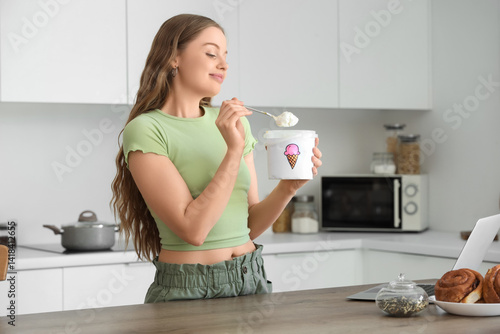Young woman enjoying ice cr...