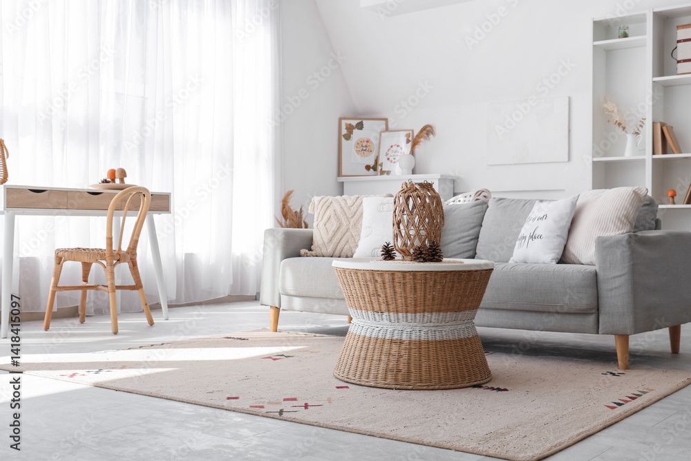 Obraz premium Interior of stylish living room with cozy sofa, shelving unit and coffee table