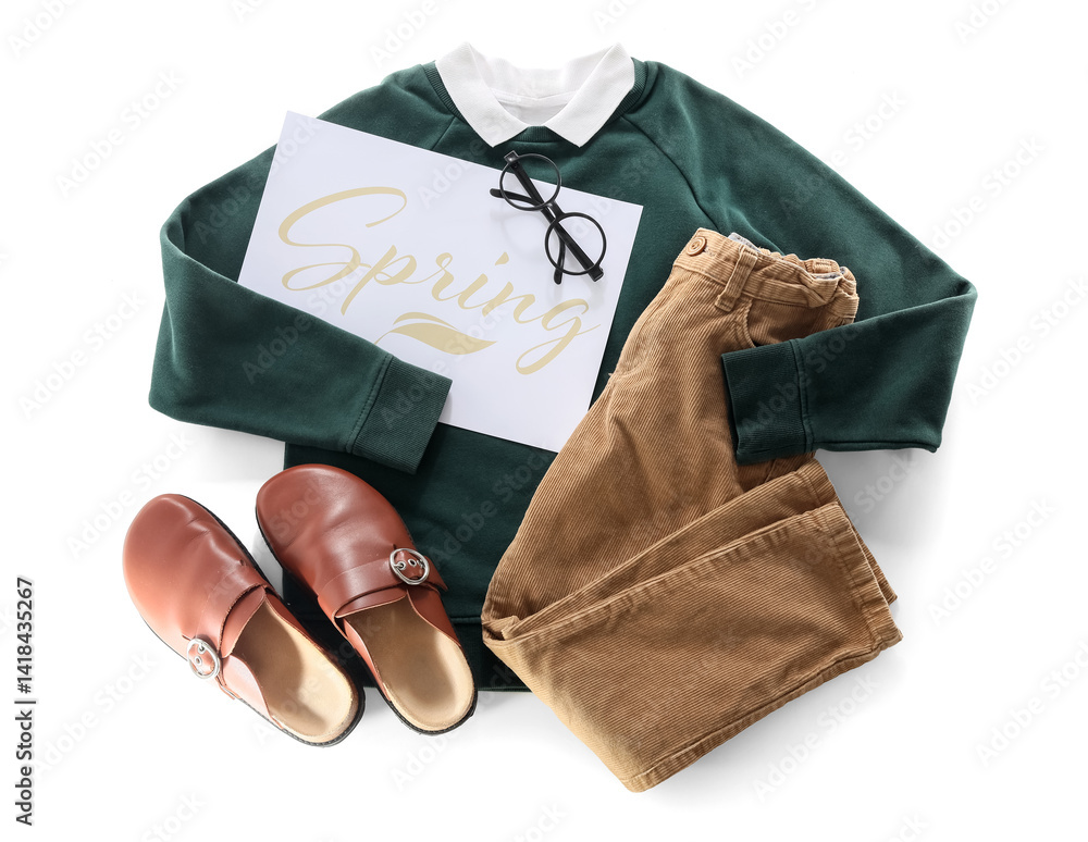 Naklejka premium Card with word SPRING, stylish children's clothes, eyeglasses and shoes on white background