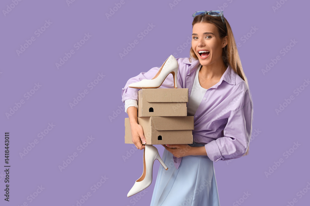 Stylish young woman with high heel and shoe boxes on lilac background