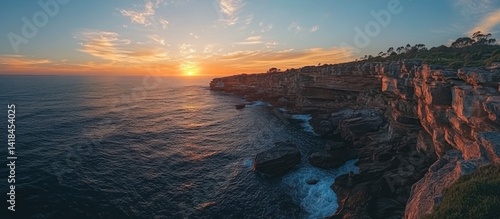 A stunning coastal sunset showcasing cliffs and ocean views