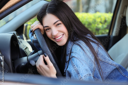 Happy young woman hugging s...