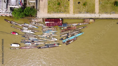 Aerial Majesty of Quibdó: River, Faith, and Rainforest. Drone views of Quibdó, Choco, Colombia, featuring the Atrato River, boats, rainforest, and the iconic cathedral. A vibrant mix of nature.