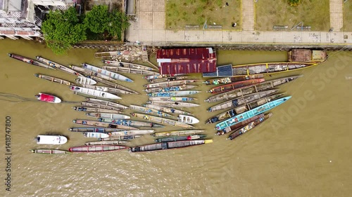 Aerial Majesty of Quibdó: River, Faith, and Rainforest. Drone views of Quibdó, Choco, Colombia, featuring the Atrato River, boats, rainforest, and the iconic cathedral. A vibrant mix of nature.