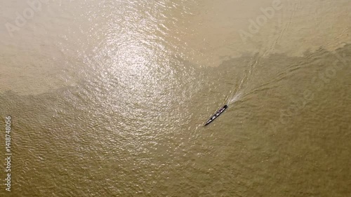 Aerial Majesty of Quibdó: River, Faith, and Rainforest. Drone views of Quibdó, Choco, Colombia, featuring the Atrato River, boats, rainforest, and the iconic cathedral. A vibrant mix of nature.
