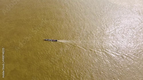 Aerial Majesty of Quibdó: River, Faith, and Rainforest. Drone views of Quibdó, Choco, Colombia, featuring the Atrato River, boats, rainforest, and the iconic cathedral. A vibrant mix of nature.