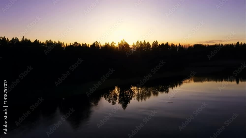 Serene Sunset Over Tranquil Lake Surrounded by Lush Green Forest Serene Sunset Over Tranquil Lake Surrounded by Lush Green Forest