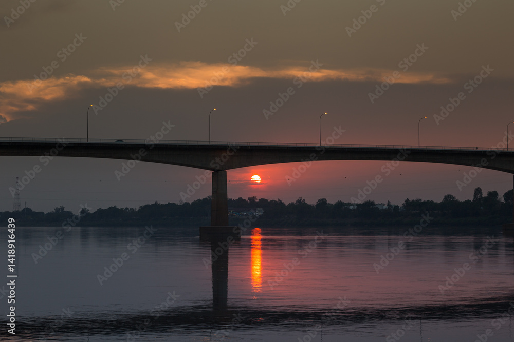 Sunset reflection over river bridge serene landscape tranquil evening scenic viewpoint nature's beauty Sunset reflection over river bridge serene landscape tranquil evening scenic viewpoint nature's beauty