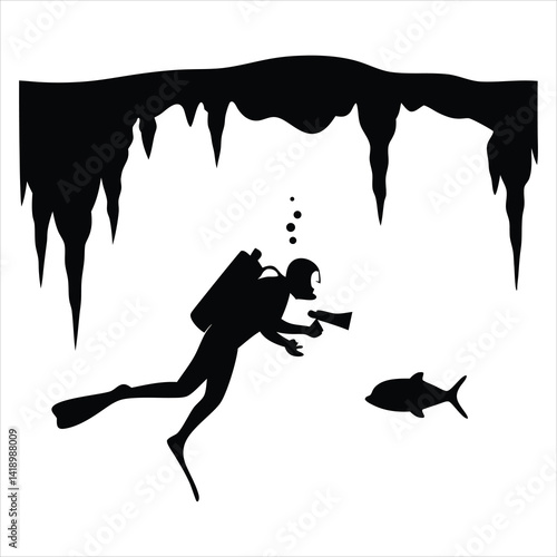 Scuba diver in cave with flashlight glowing