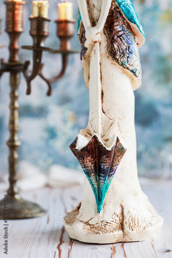 Beautiful figurine of an angel on the table.