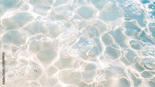 Sunlight through shallow ocean water, beach background