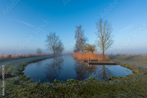 Obraz na płótnie Morning fog on the Nije Wjittering canal, Friesland, Netherlands Kopie w salonie