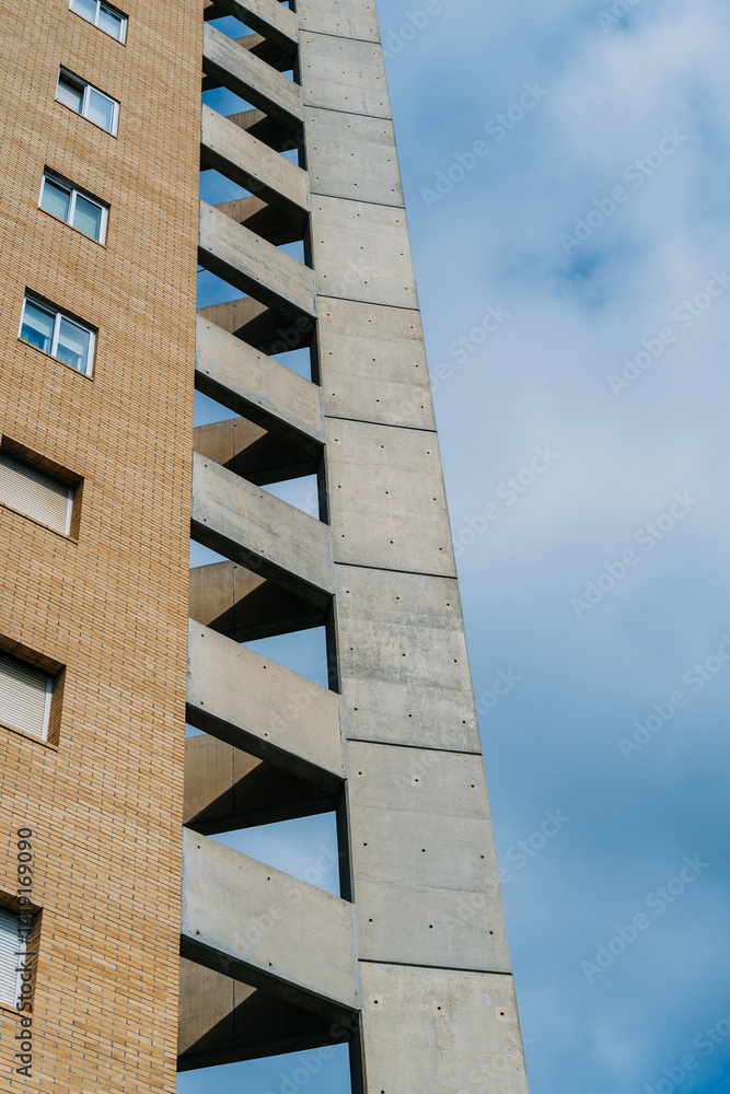 Imposing Brutalist Architecture Building Under a Clear Blue Sky. This is a classic example of brutalist architecture, characterized by its raw concrete structure and repetitive geometric shapes Imposing Brutalist Architecture Building Under a Clear Blue Sky. This is a classic example of brutalist architecture, characterized by its raw concrete structure and repetitive geometric shapes