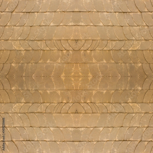 The old yellow tile wall. Yellow stone background. The texture of the tile. Brickwork. Seamless image. Symmetrical.