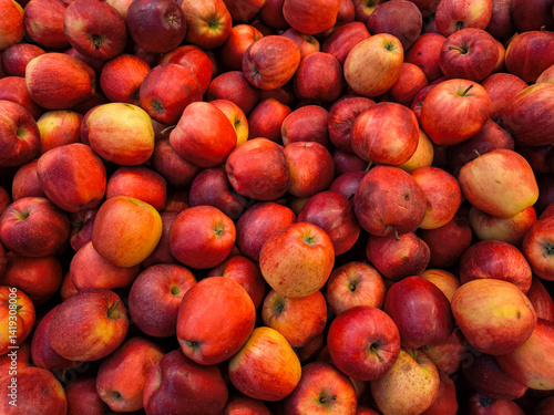Obraz na płótnie Red apples forming a colorful display at a farmer's Holesovice market in Prague, Czech republic, wallpaper, copy space w salonie