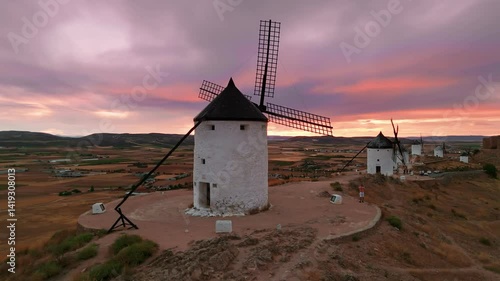 Aerial view of the windmills of Consuegra at sunset, Castilla-La Mancha, Spain.