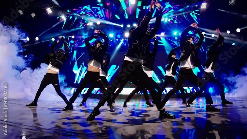 K-pop dancers performing energetic choreography on a vibrant stage  