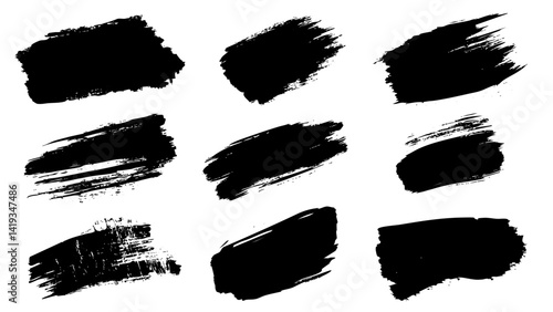 Artistic black brush strokes on a white background for creative design elements