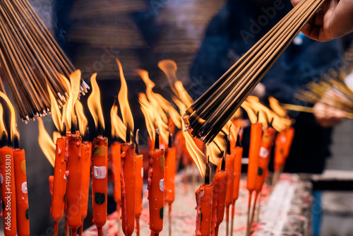 Burning incense sticks in a hong kong temple ritual