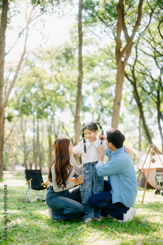 Happy parents and daughter Bakery and Bread Fruit enjoy in a sunny garden. A joyful summer picnic full of love, food for family Happy parents and daughter Bakery and Bread Fruit enjoy in a sunny garden. A joyful summer picnic full of love, food for family