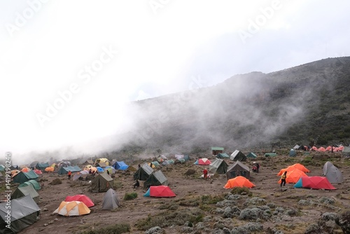 Misty scenery of Barranco Camp with tents on trail to Kilimanjaro Peak,  Machame Route, Tanzania