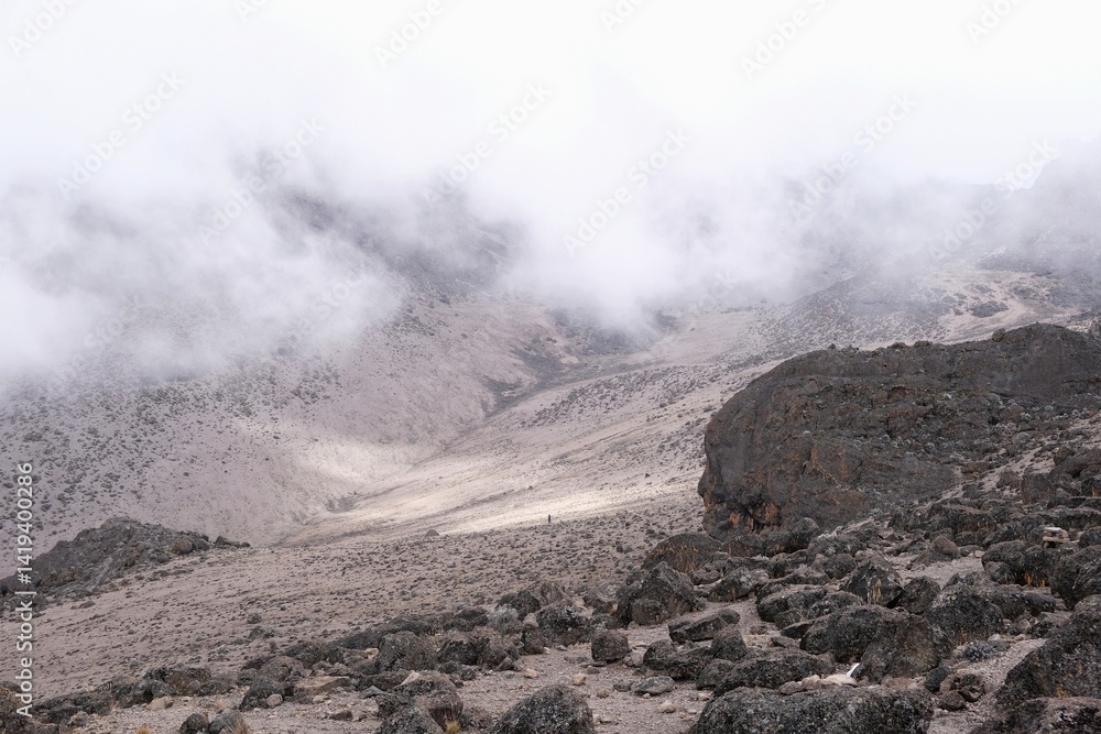 Little single person on trail from Barranco Hut to Barafu Camp, during trekking to Kilimanjaro Peak, Machame Route, Tanzania