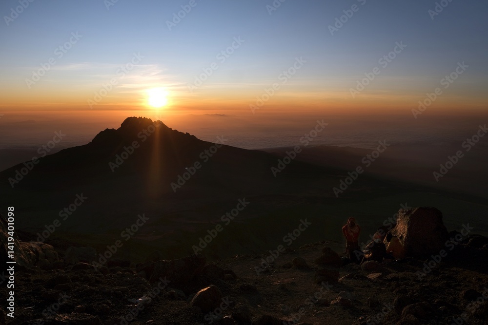 Sunset scenery with Mawenzi Peak on horizon during climbing to Uhuru peak on Kibo volcano (Kilimanjaro) – 5895 m. Tanzania