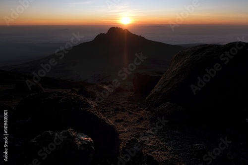 Obraz na płótnie Sunset scenery with Mawenzi Peak on horizon during climbing to Uhuru peak on Kibo volcano (Kilimanjaro) – 5895 m. Tanzania w salonie