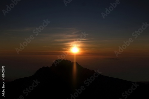 Obraz na płótnie Sunset scenery with Mawenzi Peak on horizon during climbing to Uhuru peak on Kibo volcano (Kilimanjaro) – 5895 m. Tanzania w salonie