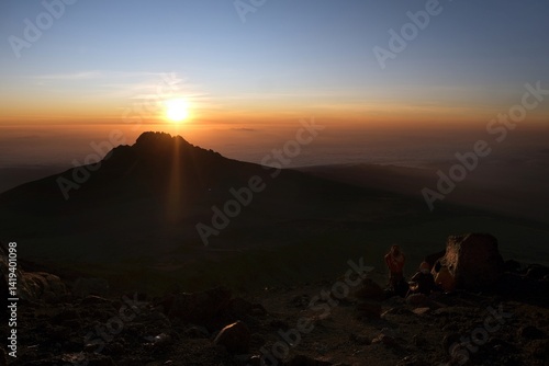 Obraz na płótnie Sunset scenery with Mawenzi Peak on horizon during climbing to Uhuru peak on Kibo volcano (Kilimanjaro) – 5895 m. Tanzania w salonie