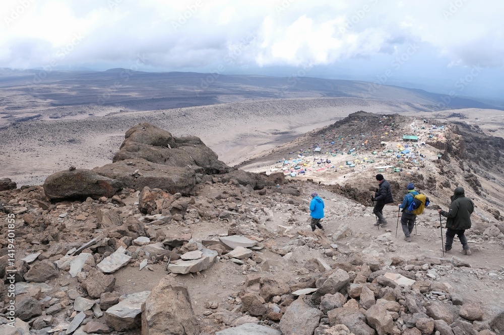 Scenery of trekking people on trail during descending from Kilimanjaro Peak, Tanzania