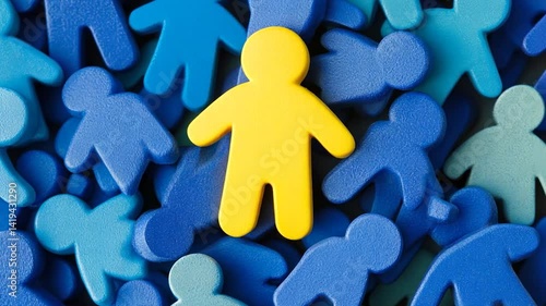 Yellow figure amidst a crowd of blue figures