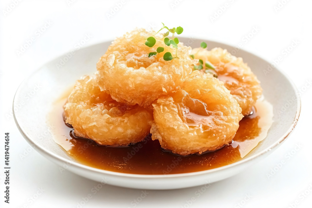 a plate of food with sauce and some sort of food a plate of food with sauce and some sort of food