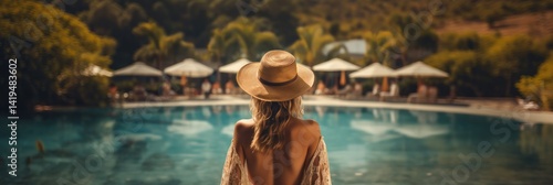 Woman in a long dress and hat near the pool at sunset. Vacation concept. Travel concept, Summertime concept with copy space.