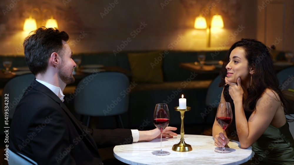 Waitress bringing the bill for man. Couple having date in the restaurant. Lifestyle, love, relationships concept. Waitress bringing the bill for man. Couple having date in the restaurant. Lifestyle, love, relationships concept.