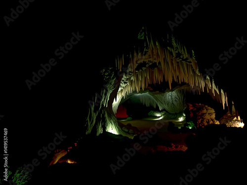 Obraz na płótnie A cave with a light shining on it. The cave is dark and the light is illuminating the cave w salonie
