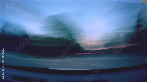 timelapse hyperlapse during a car trip with the lights of the cars and cities very blurry and sped up. It seems to be in a futuristic world
