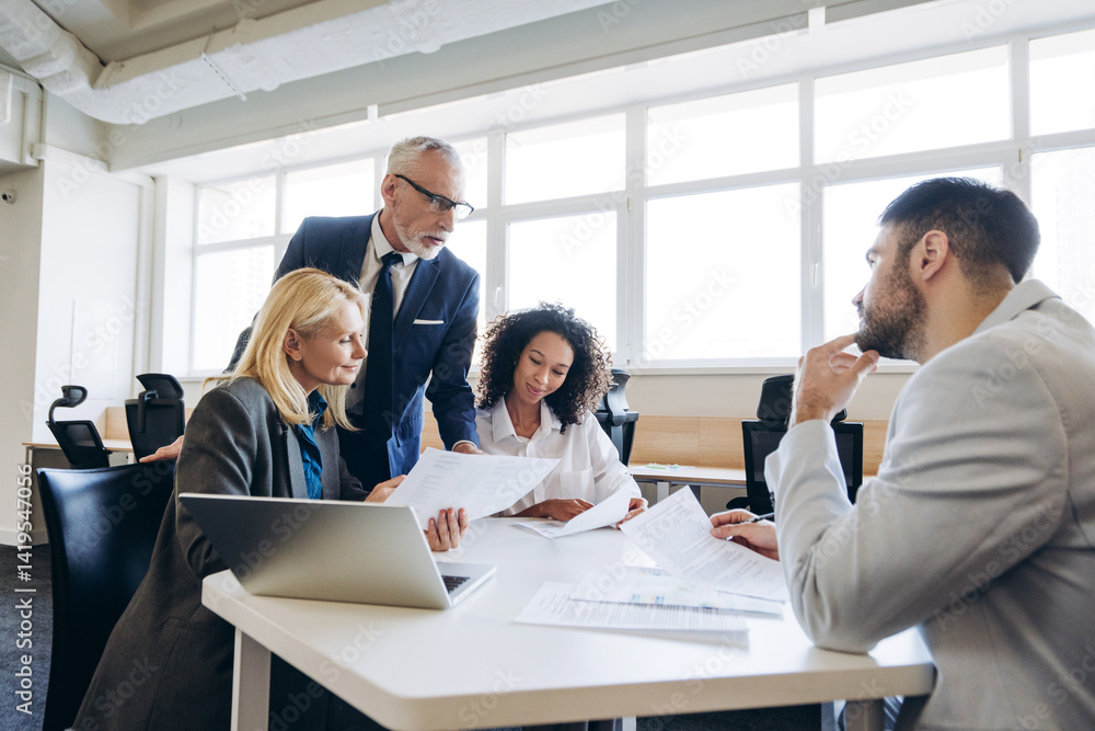 Diverse business team, multinational group collaborating in modern office Diverse business team, multinational group collaborating in modern office