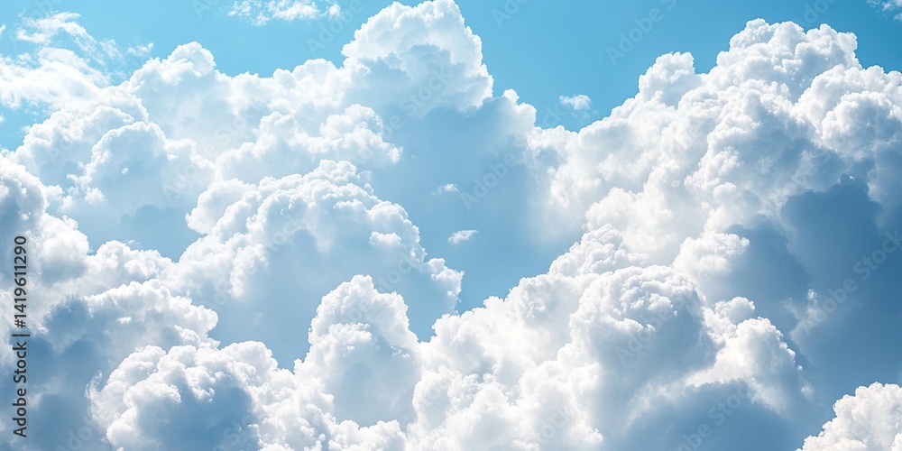 Fluffy Clouds Against a Bright Blue Sky Fluffy Clouds Against a Bright Blue Sky