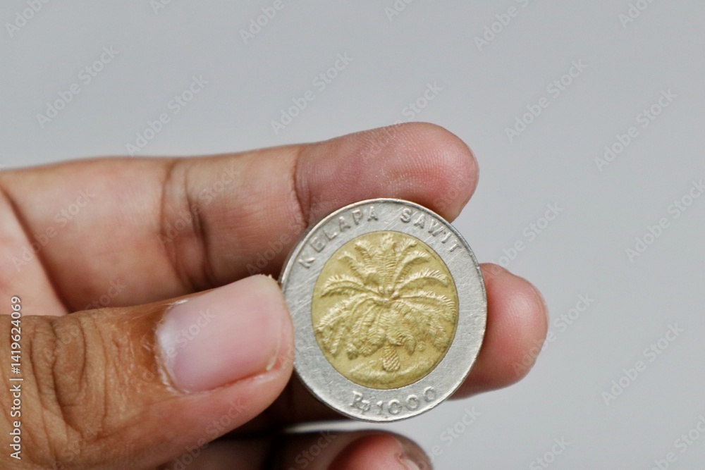 Kudus, 19 April 2025 - 1000 rupiah coin indonesia palm oil