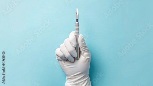 Close-up of a gloved hand holding a sharp scalpel against a blue background. Ideal for illustrating surgery and medical instruments