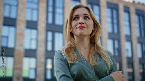Closeup blonde lady looking views downtown. Creative smiling manager pondering