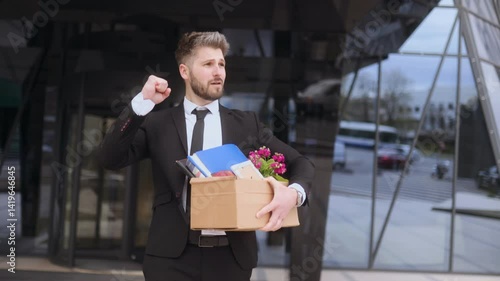 Wallpaper Mural Joyful man celebrating outside office after receiving layoff notice Torontodigital.ca