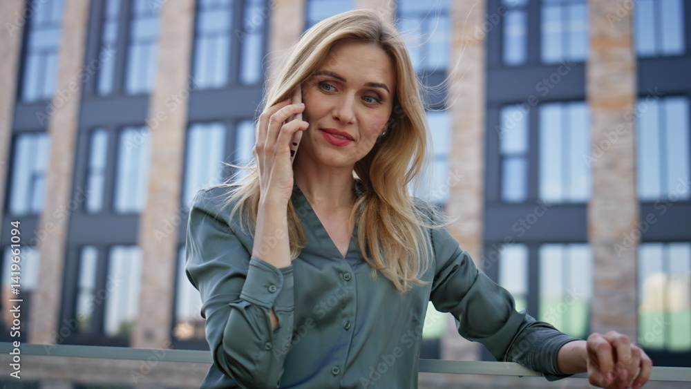 Blonde woman talking smartphone downtown closeup. Business manager having call