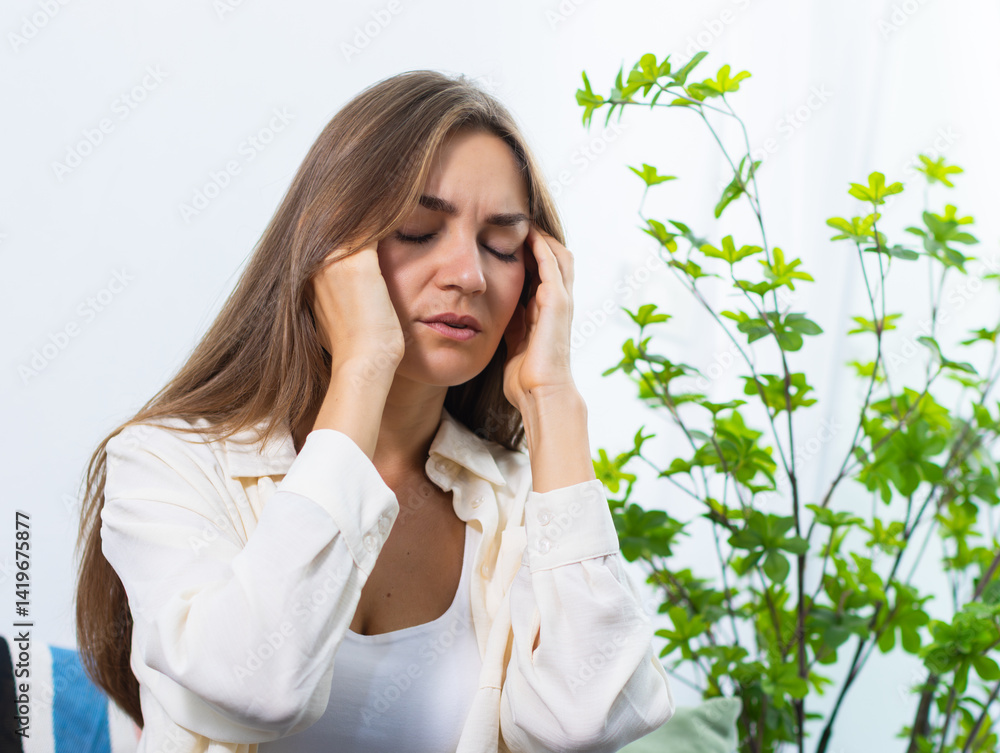Stressed, Headache Woman with anxiety, fatigue, migraine and sick person sits on sofa in living room at home. Anxiety woman suffering head feeling unwell, pain, depression with mental health crisis. Stressed, Headache Woman with anxiety, fatigue, migraine and sick person sits on sofa in living room at home. Anxiety woman suffering head feeling unwell, pain, depression with mental health crisis.