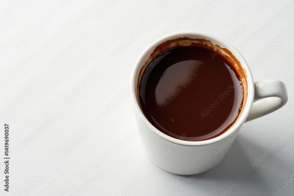 Fototapeta premium Rich, dark hot chocolate in a mug, white table backdrop, holiday, energy